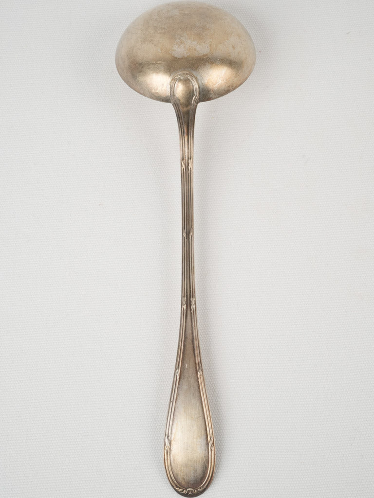 Elegant antique soup serving ladle