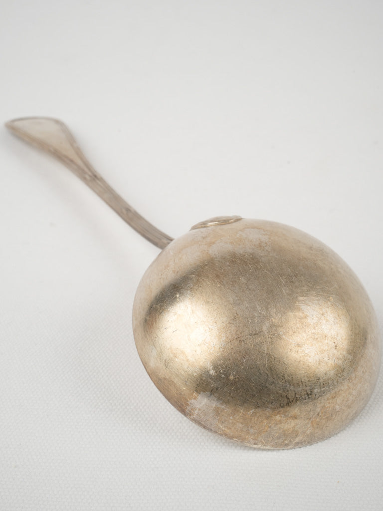 Graceful vintage silver ladle