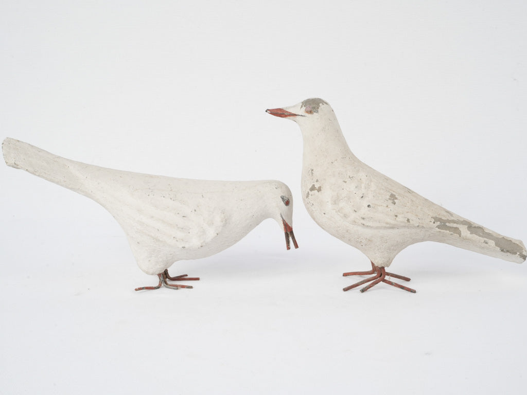 Elegant, weathered white bird figures