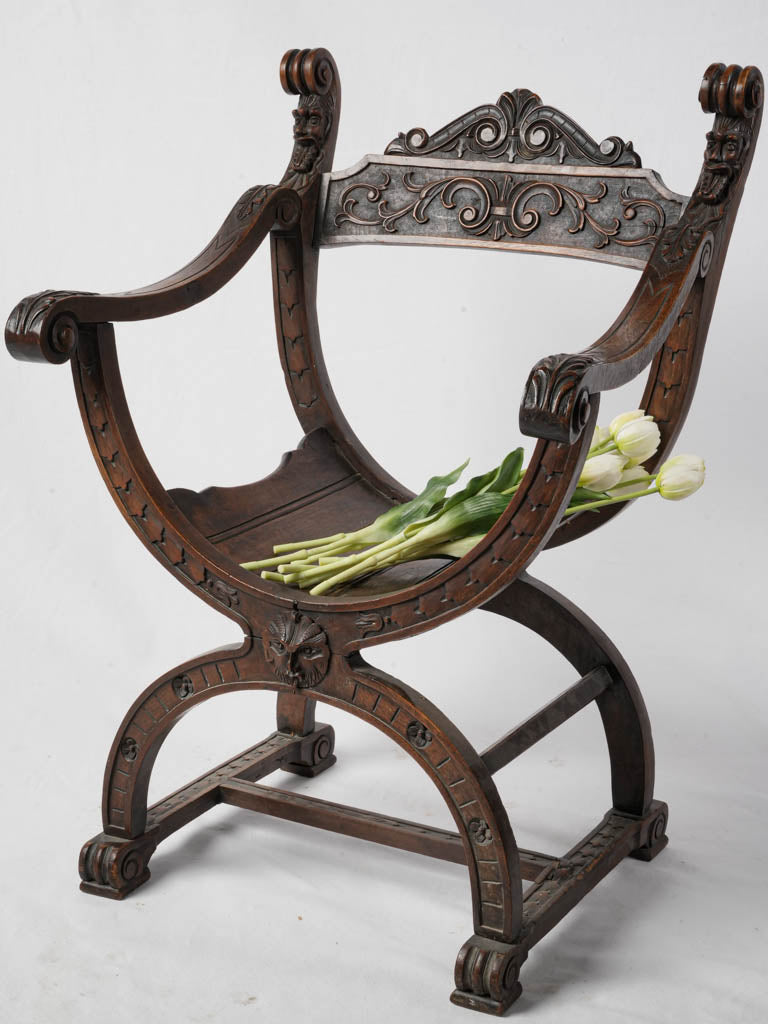 Antique elegant Savonarola armchair