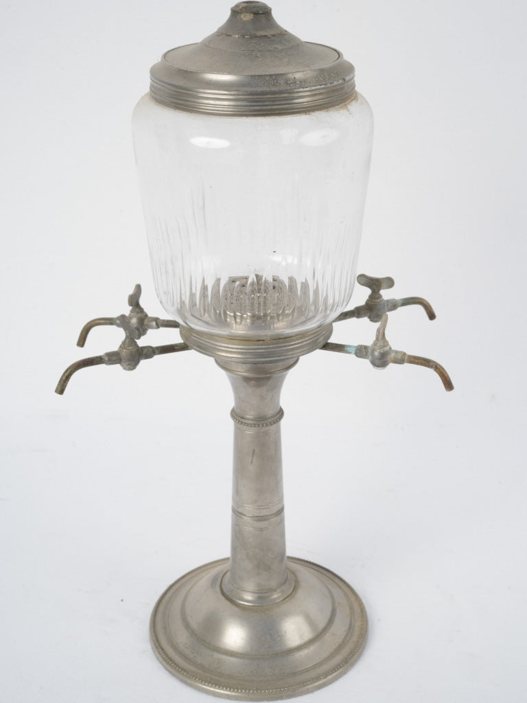 Vintage absinthe fountain with four taps