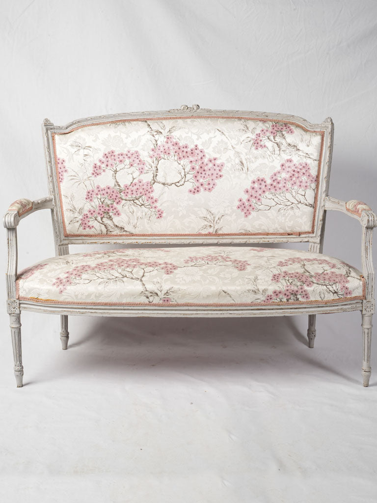 Elegant pink floral upholstered sofa