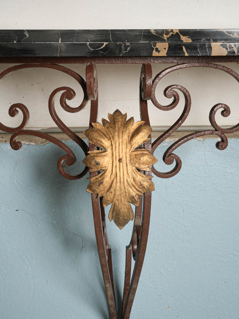 Lustrous black Portoro marble consoles