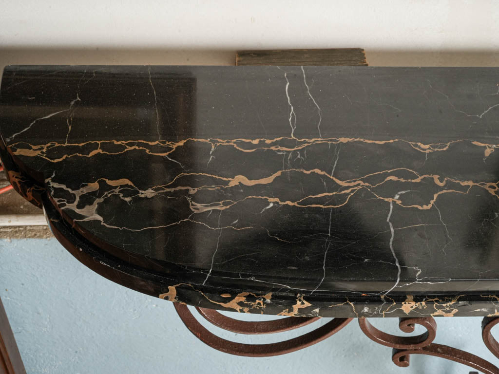 Gilded foliate sunburst consoles