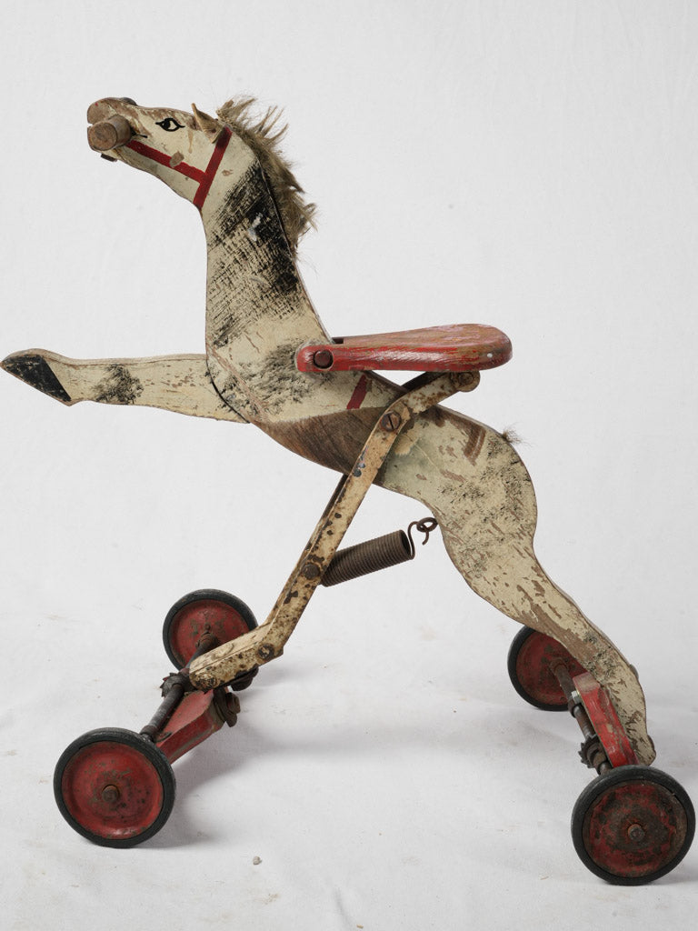 Rustic style toy horse on wheels