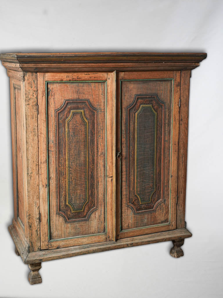 Timeworn polychrome accent cupboard