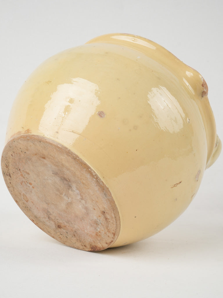 Antique milking vessel with yellow glaze