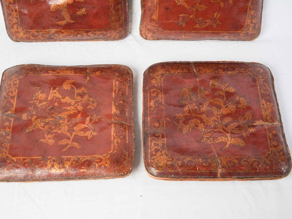 Ornate gilt scrollwork leather cushions