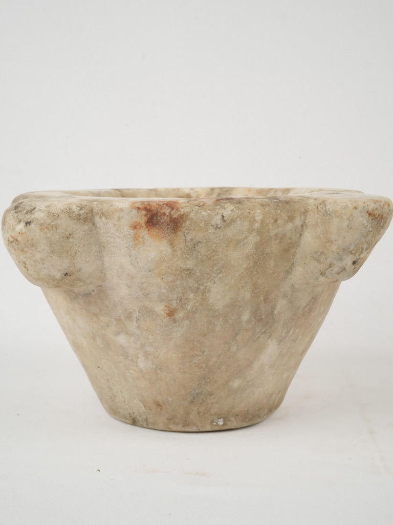 Aged marble mortar and wooden pestles