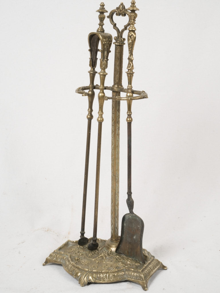 Ornate antique bronze fireplace set