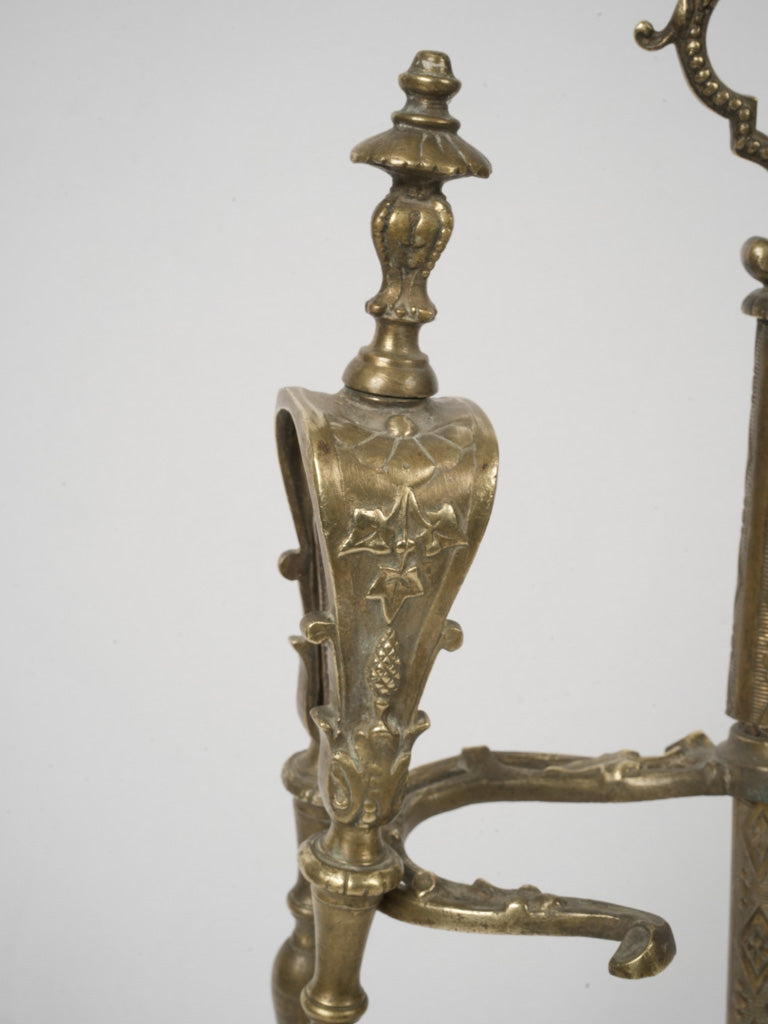 Intricate bronze fireplace adornment