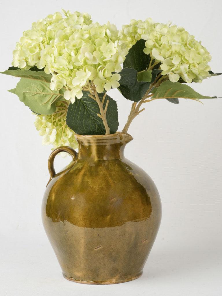 Antique olive-green ceramics carafe