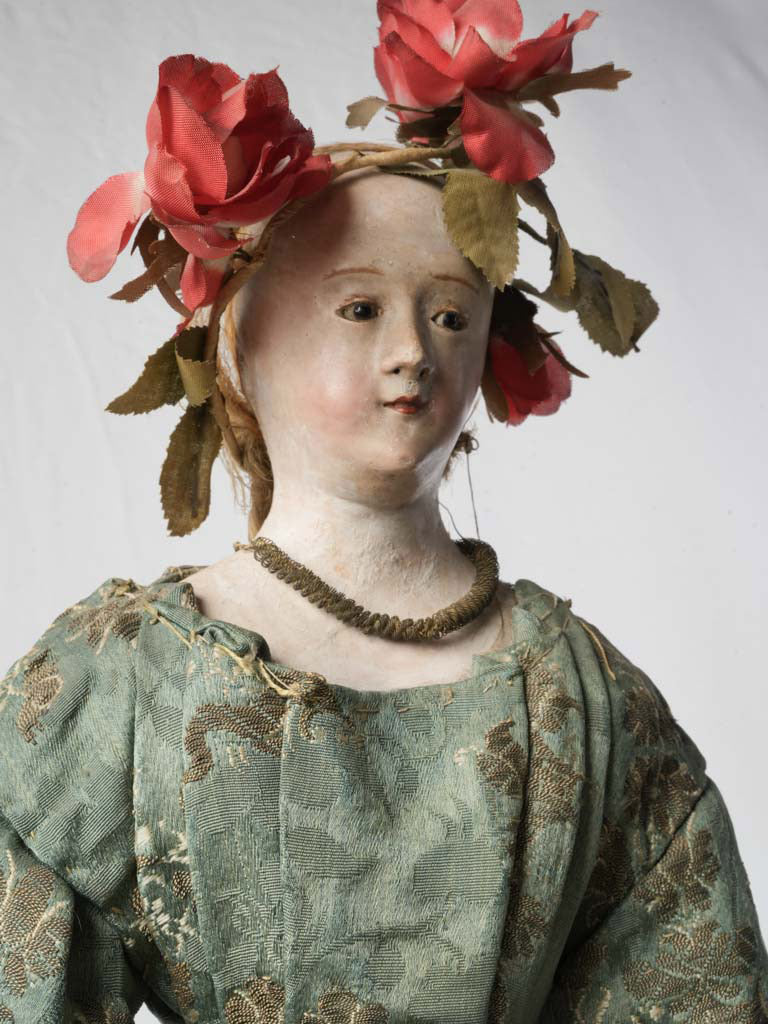 Vintage lace-adorned wooden effigy