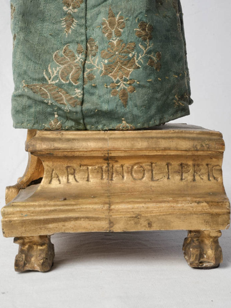 Rustic age-toned devotional sculpture