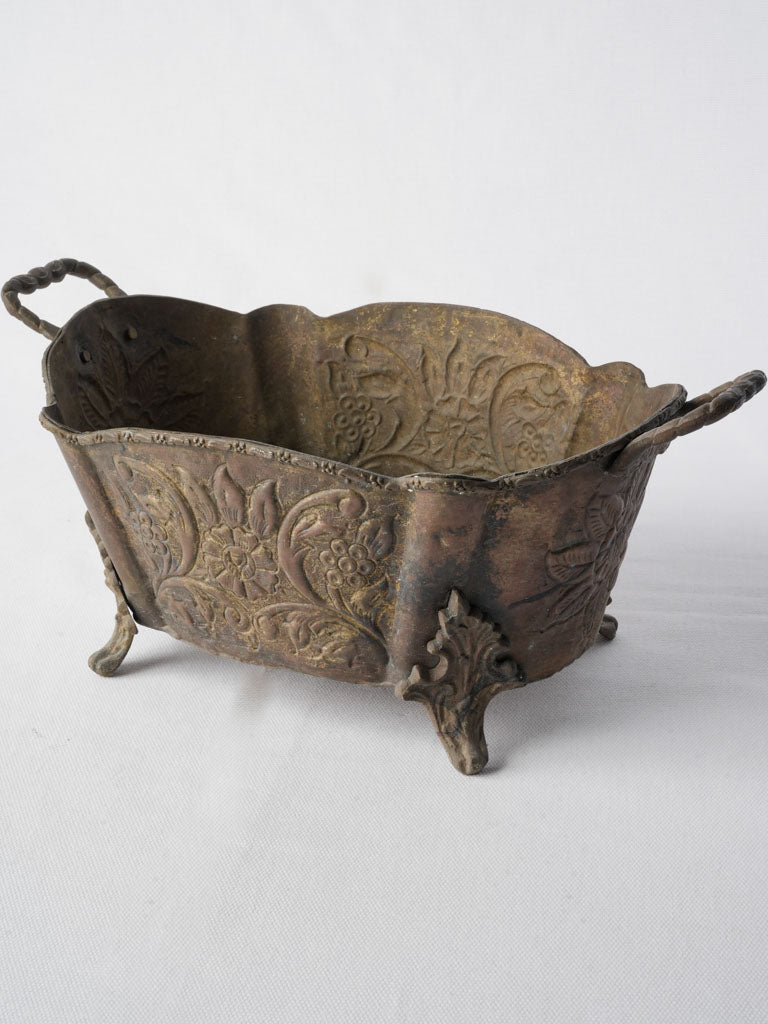 Timeworn repoussé brass table jardinière