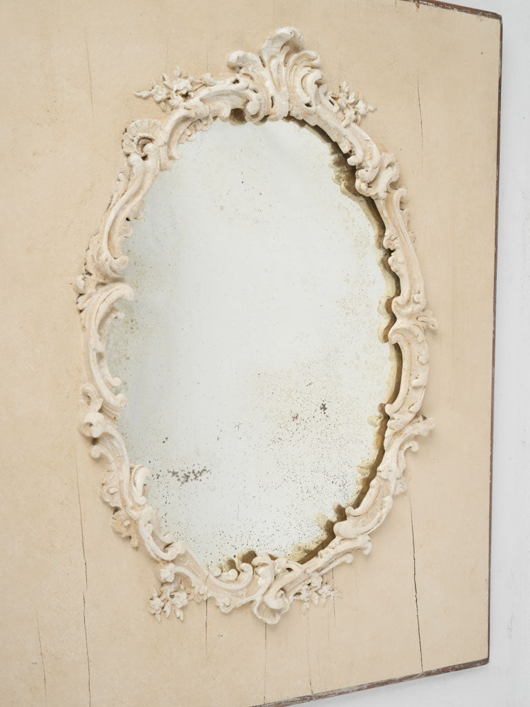 Antique off-white floral framed mirror