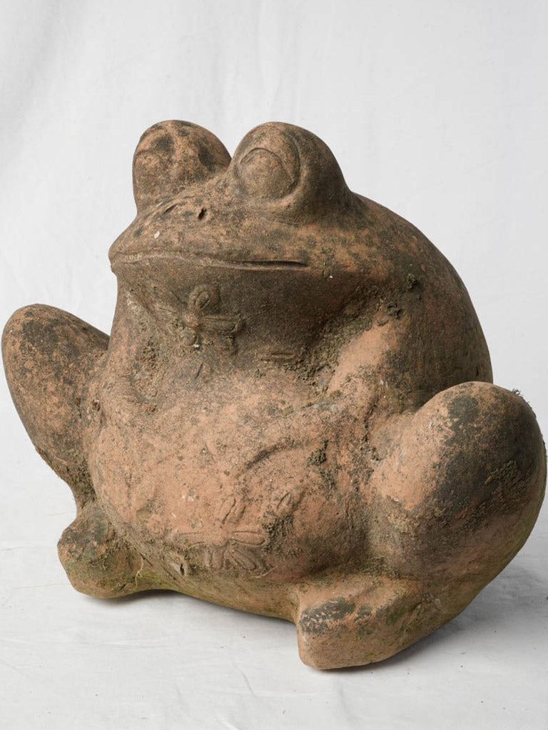 Rustic weathered garden frog sculpture