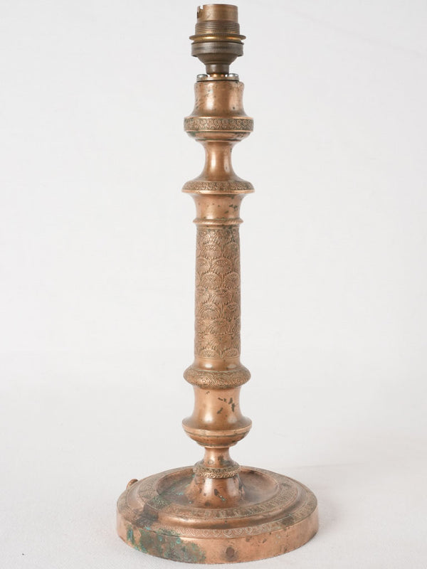 Antique bronze-finished palmette candlestick lamp base