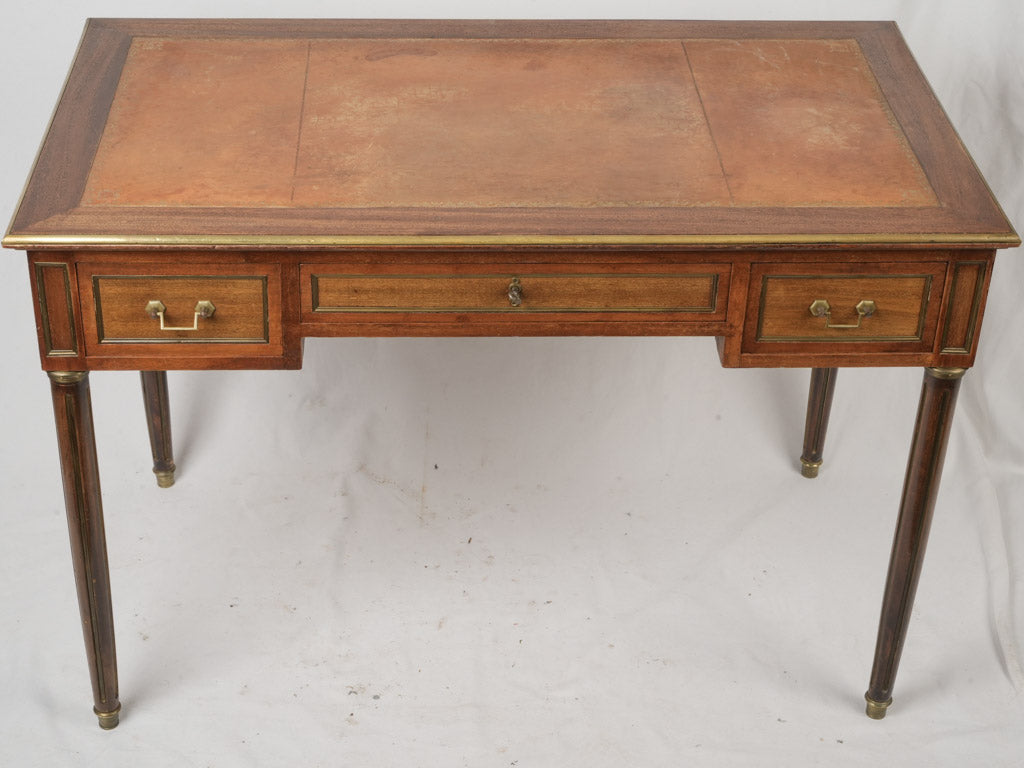 Antiquated brass-capped feet desk