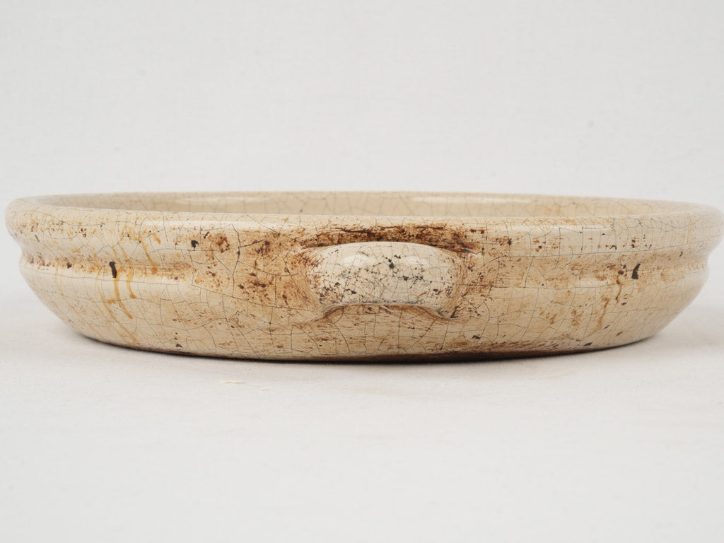 Traditional ochre-red-brown earthenware baking dish