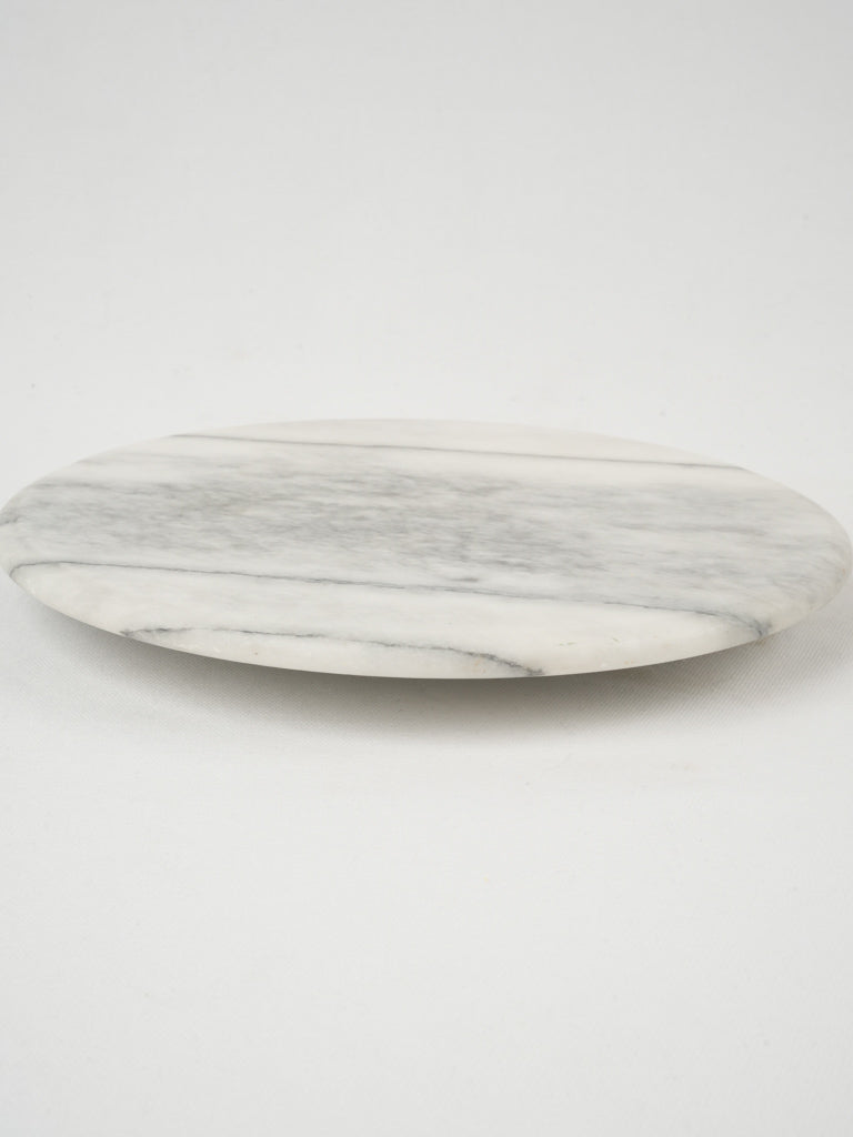Sleek, rotating marble cheese serving platter