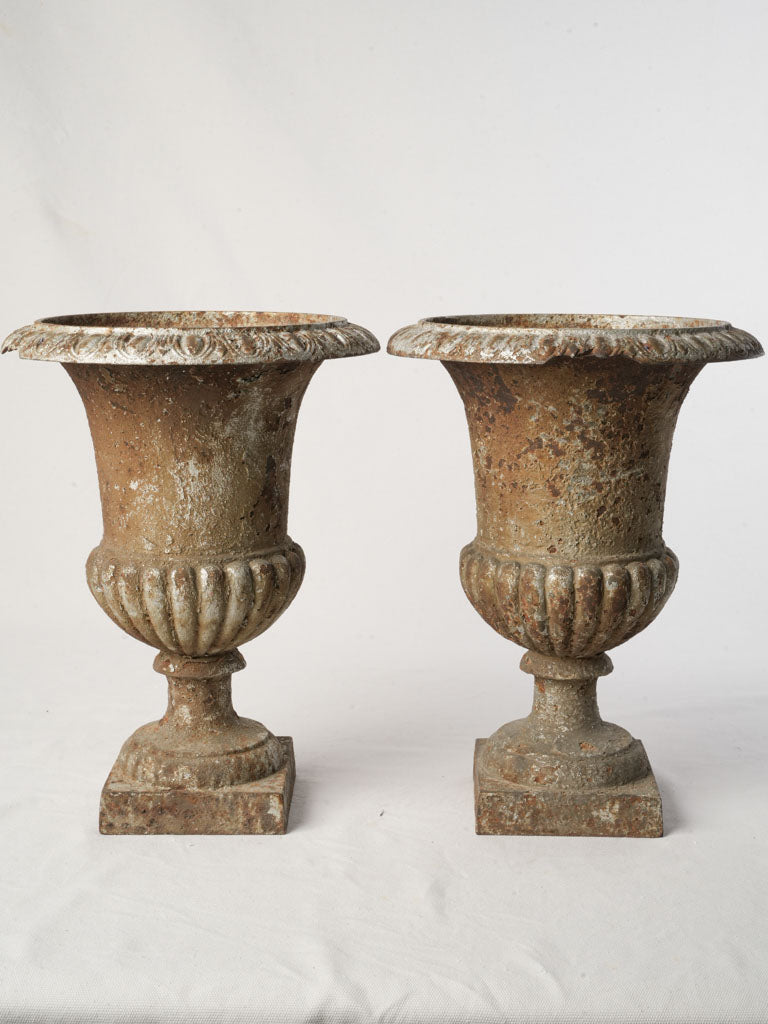 Petite mid-scale cast-iron urns