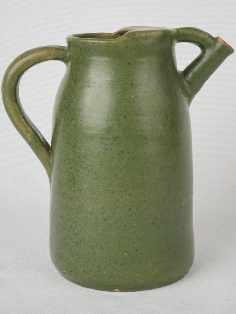 Antique partly enclosed top pitcher
