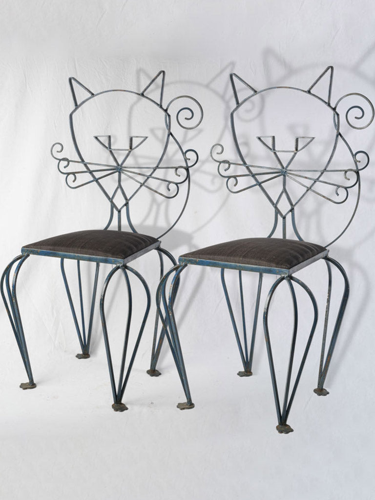French handcrafted iron cat motif.