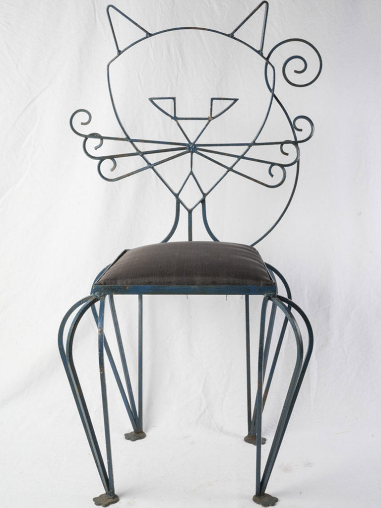 1940s stylized feline mask chairs.