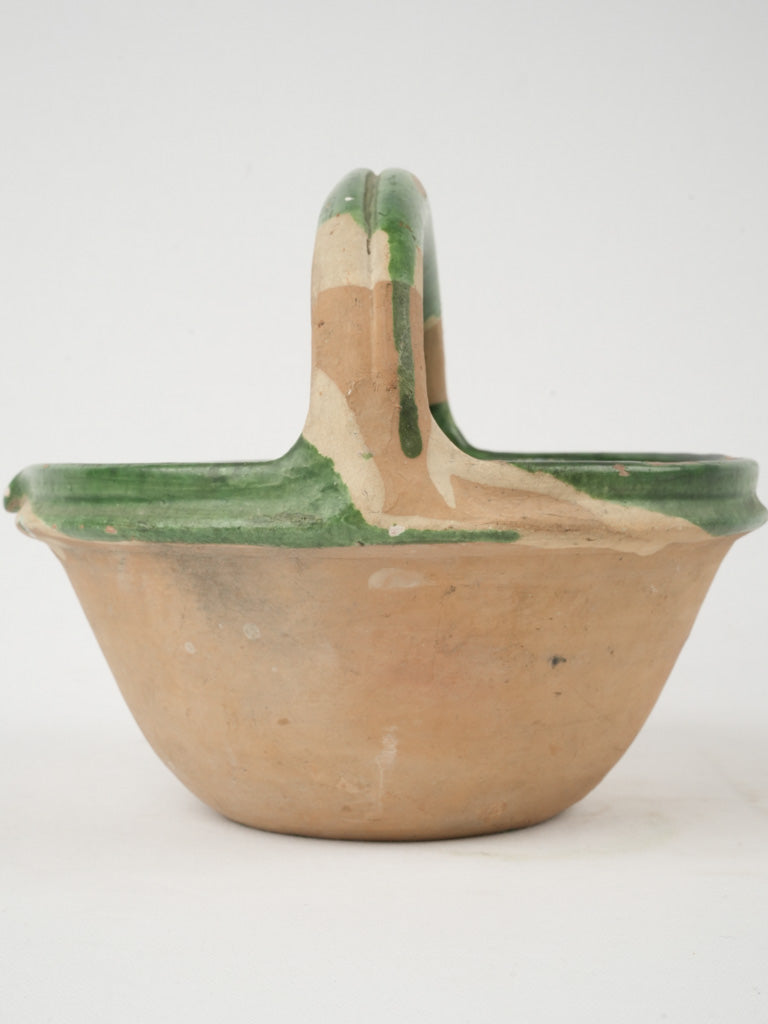 Rustic beaked terracotta cooking pot