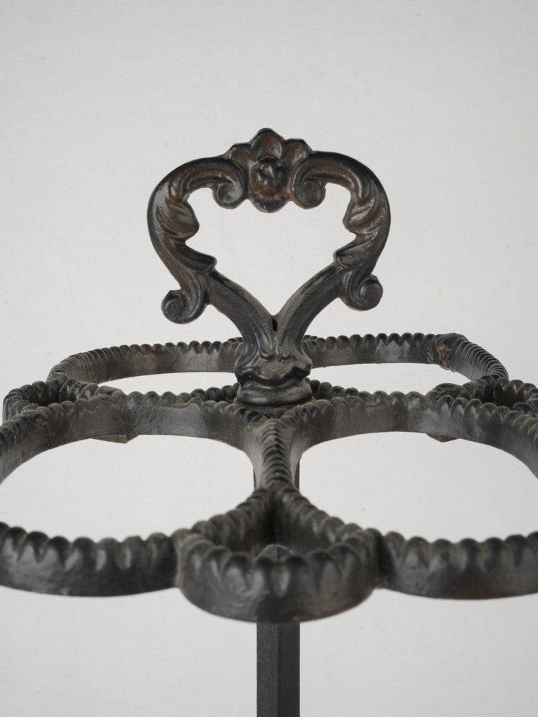 Charming entryway iron umbrella stand