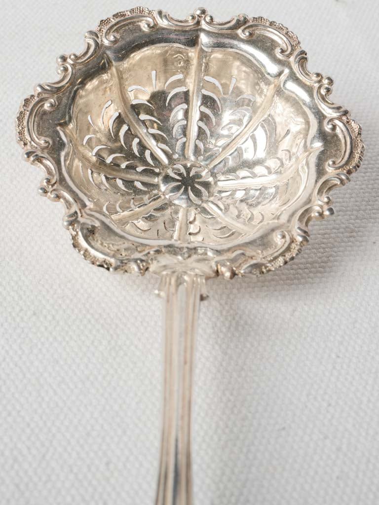 Ornate scrolling detailed sifter