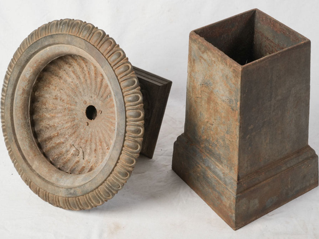Weathered cast iron plinth urn