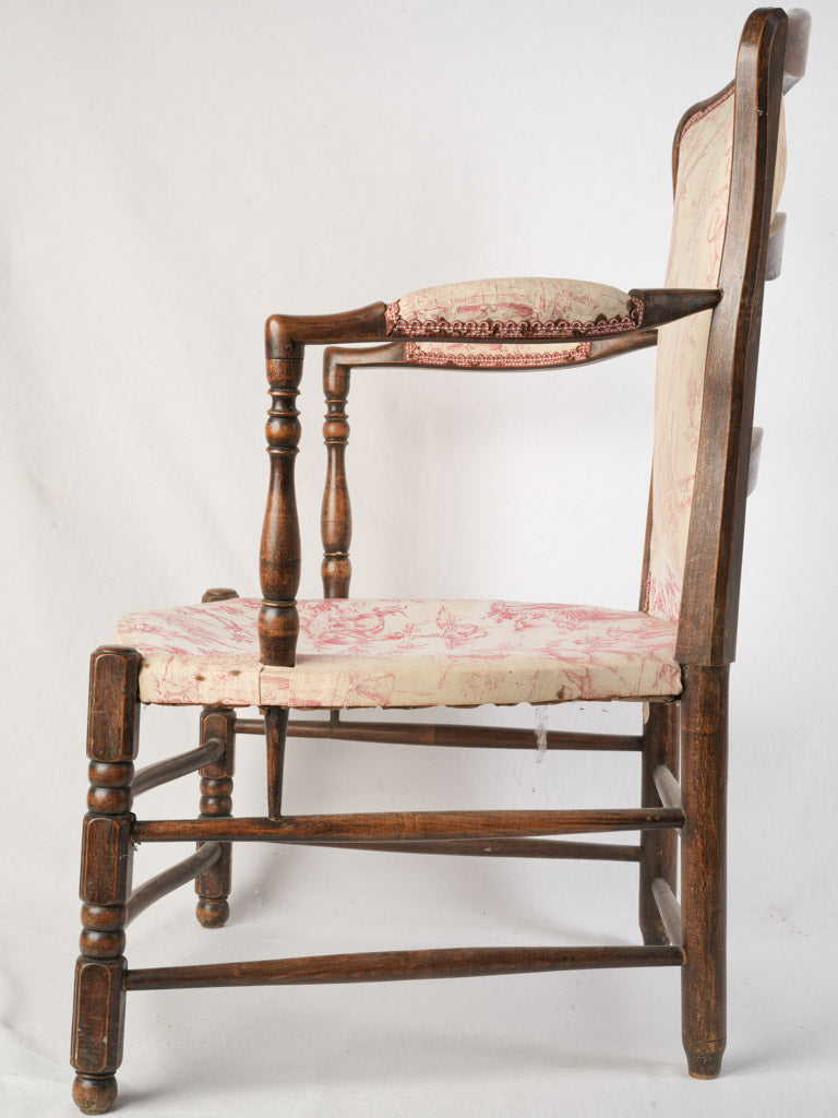 Graceful low walnut armchair