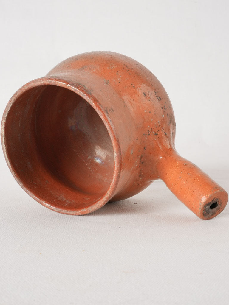 Aged terracotta marmite with handle