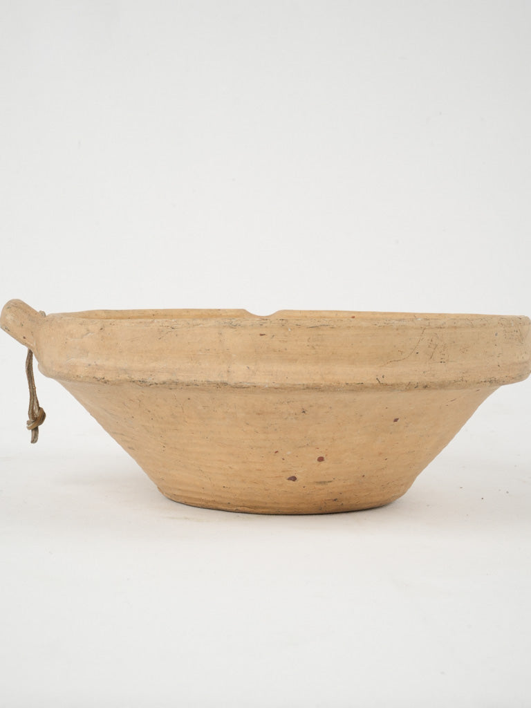 Weathered rustic pottery colander