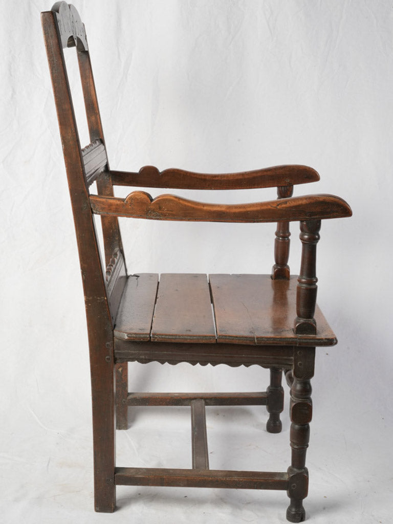 Shaped arms walnut folk armchair