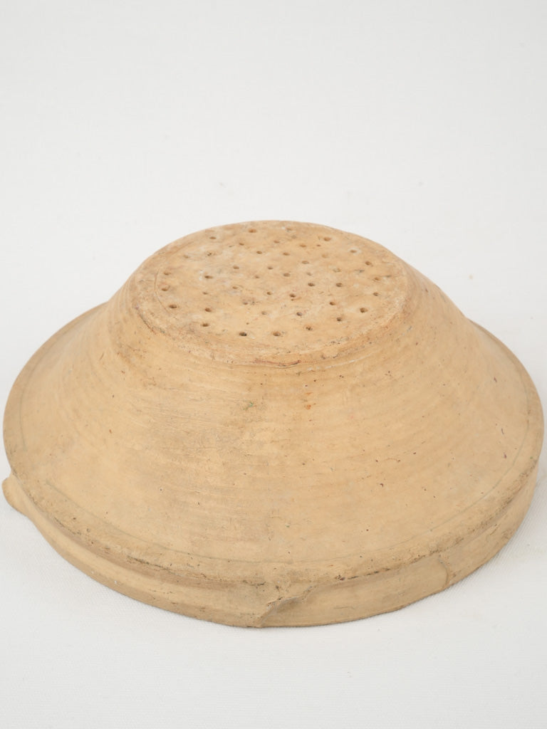 Charming weathered clay fruit drainer