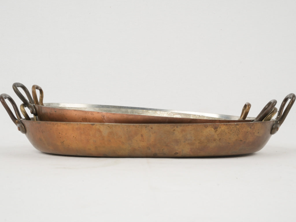 Elegant, re-tinned brass-handled gratin pans