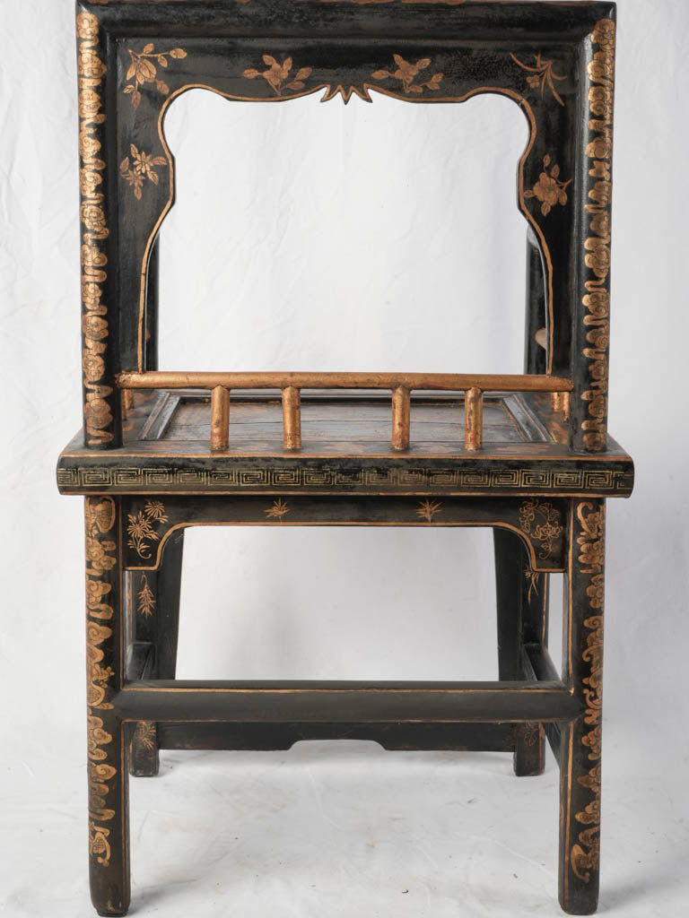 Richly ornate square frame chair
