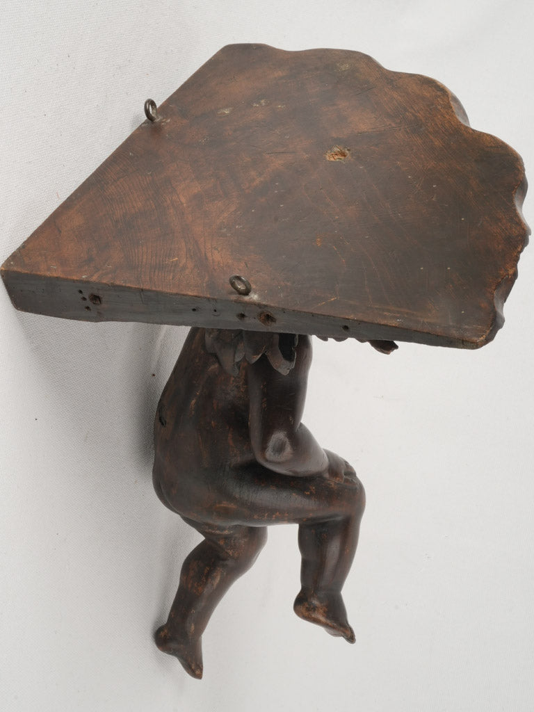 Playful shell-motif wooden sconce