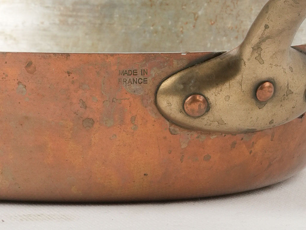 Shiny new oval copper sauté pan