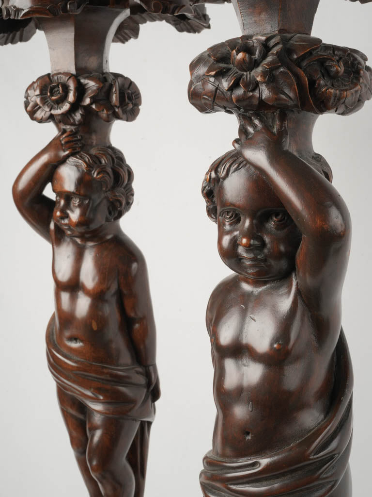 Elegant finely sculpted putti pedestals