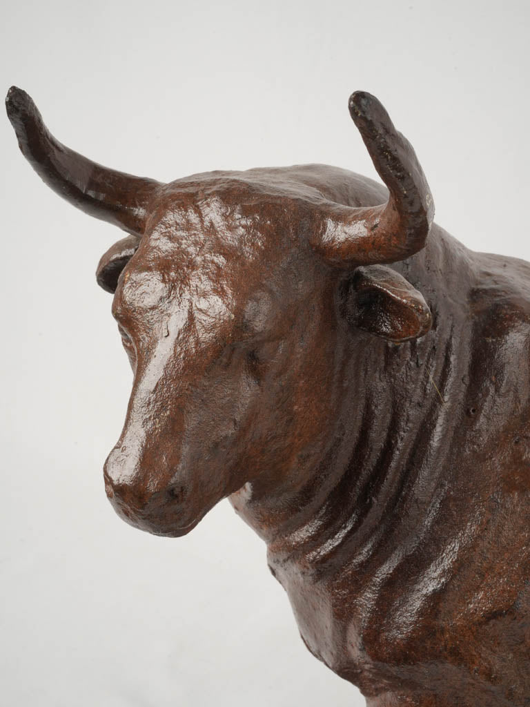 Textured iron cast bull statue