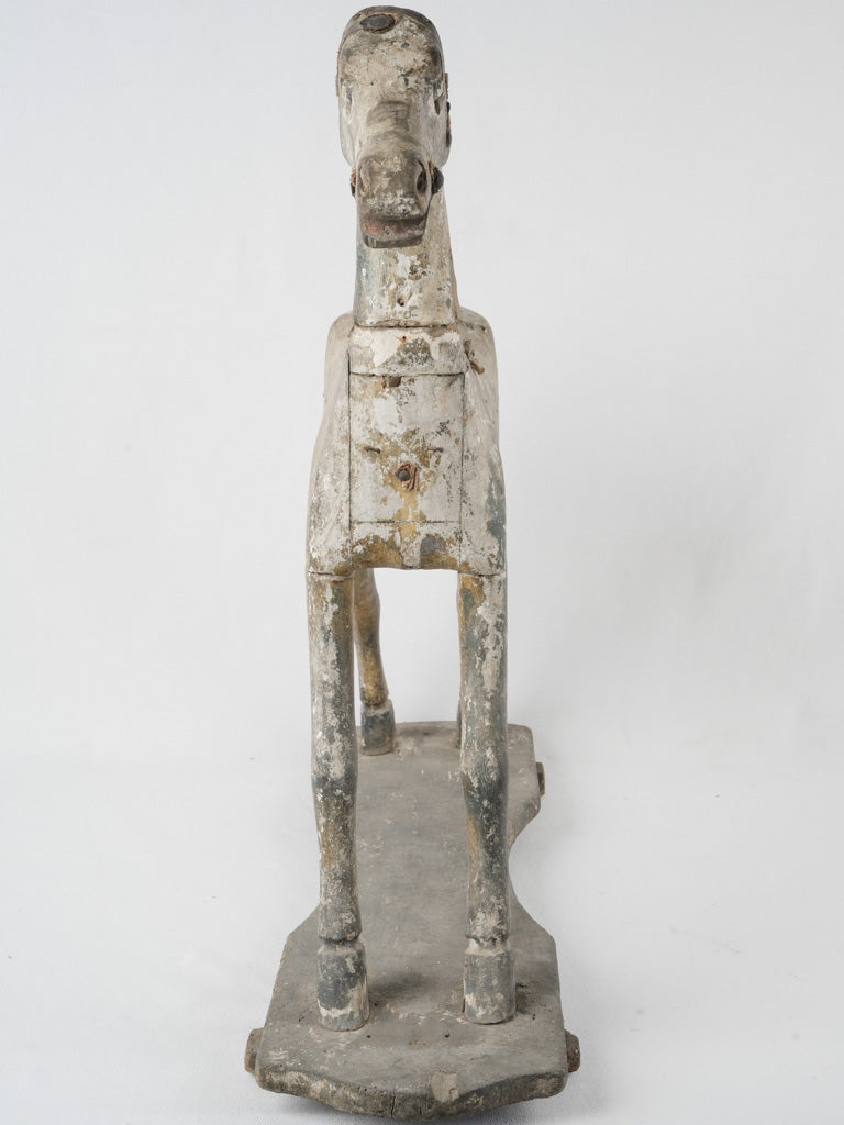 Artisanal, faded, wooden horse figurine