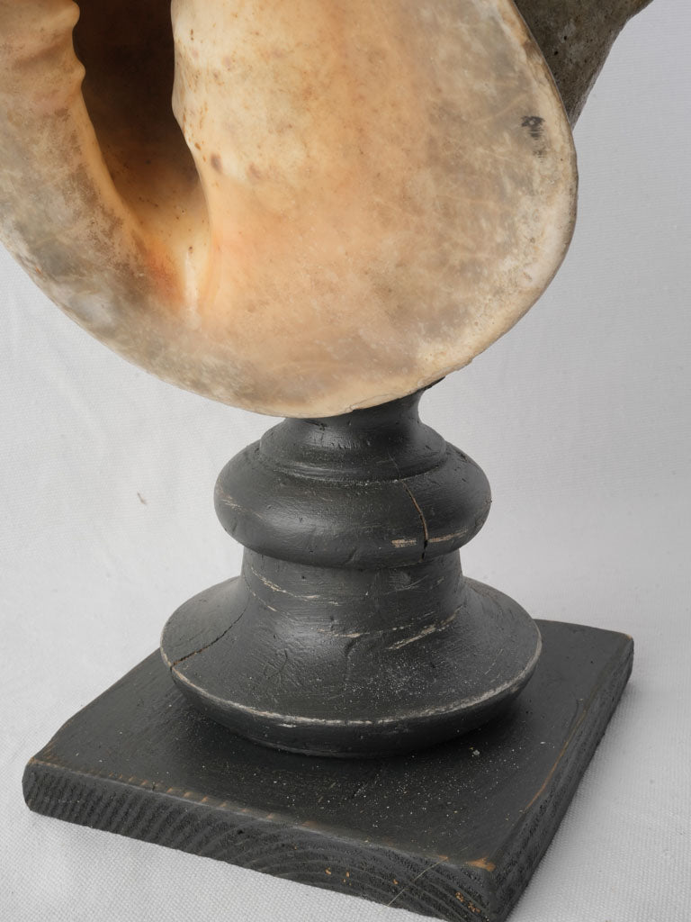 Aged elegant marine form figurine