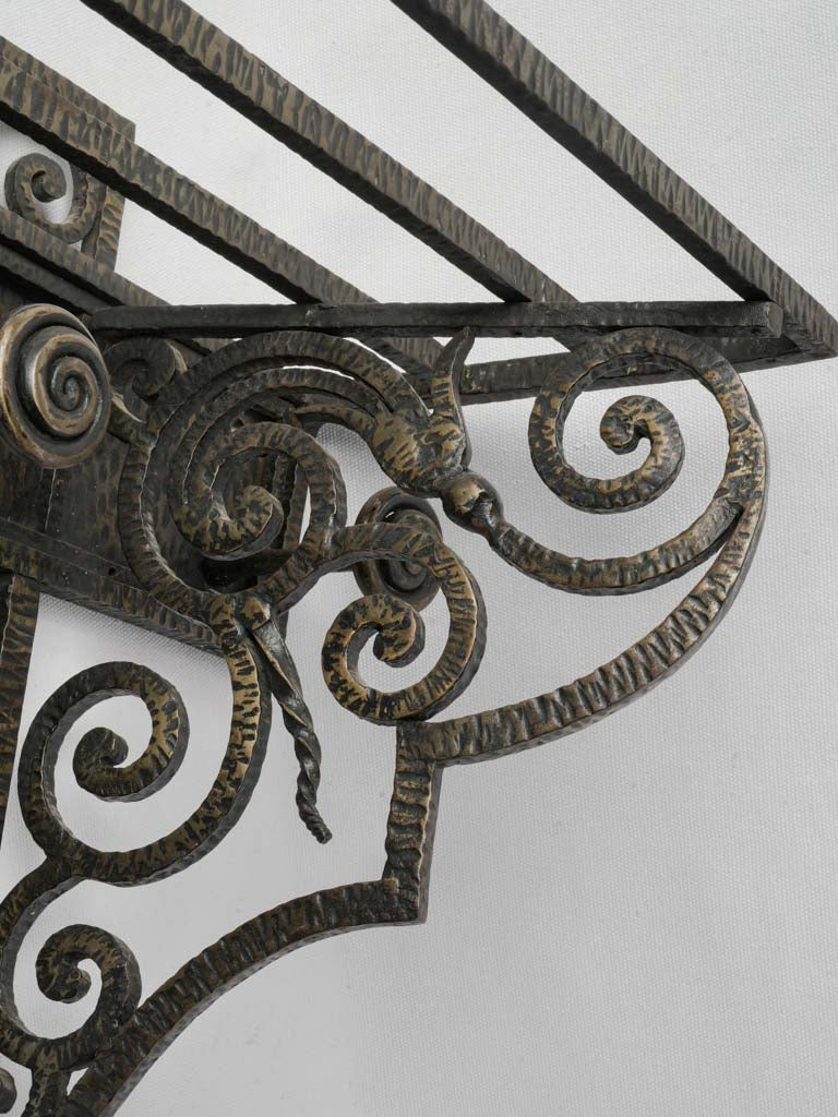 Ornate symmetrical scrolls coat hanger