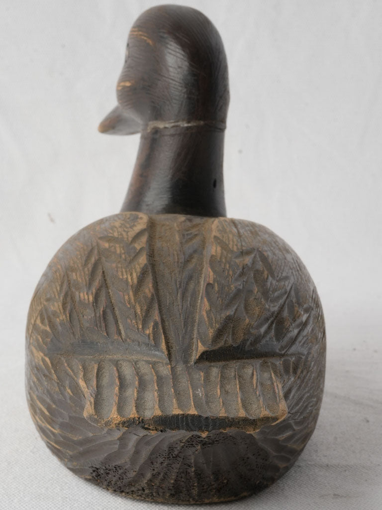 Textured brown hand-carved decoy