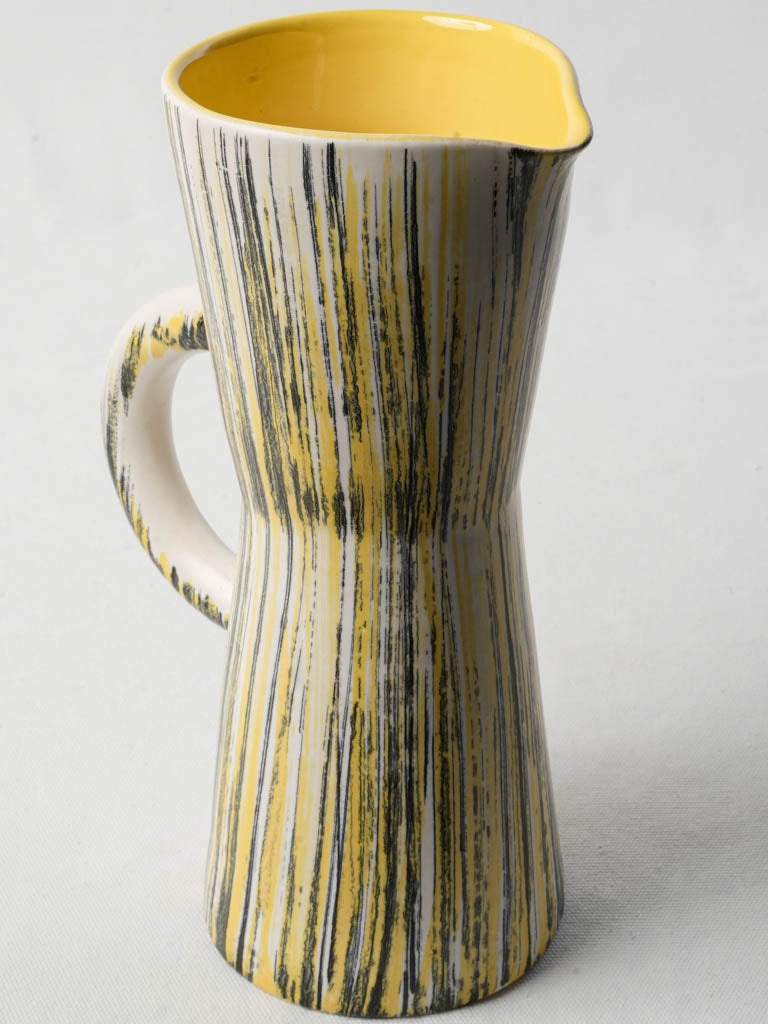 Yellow striated modernist juice pitcher
