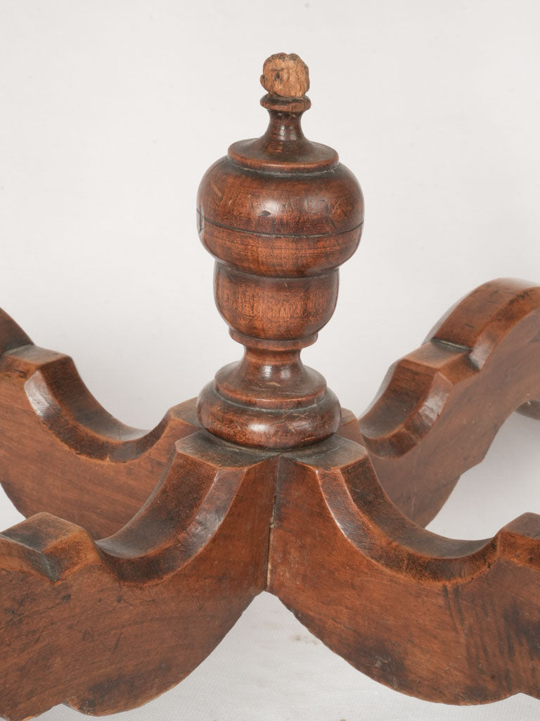 Intricately contoured walnut side table